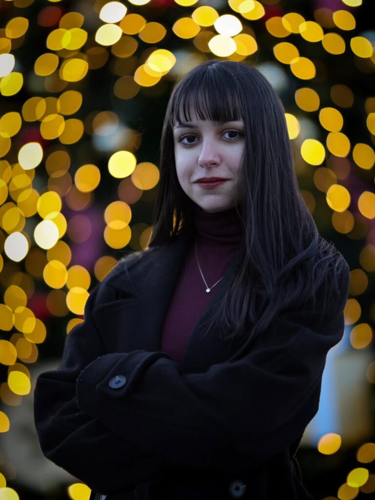 Gentle presence, wrapped in warm lights.